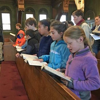 Kids singing during Sunday service